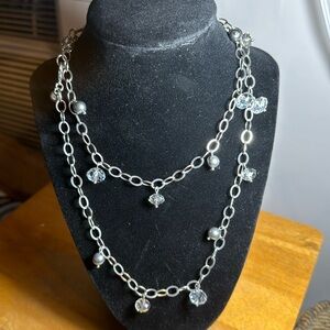 Infinity Necklace  clear beads and silver color beads.